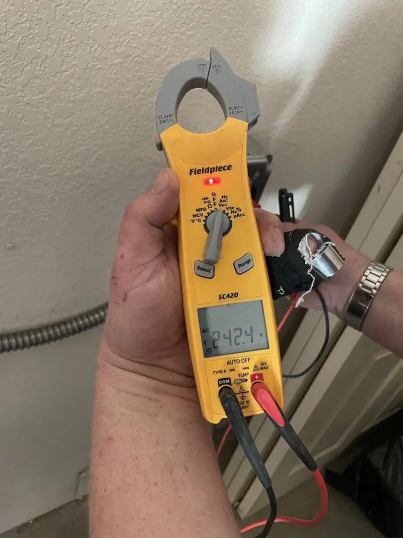 Voltage testing with clamp meter during Outlet Installation in Manasquan